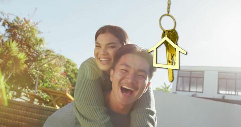 Happy Biracial Couple Celebrating New Home