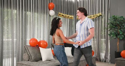 Couple Dancing Together at Home Birthday Celebration