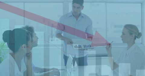 Professional Team Analyzing Business Charts in Conference Room