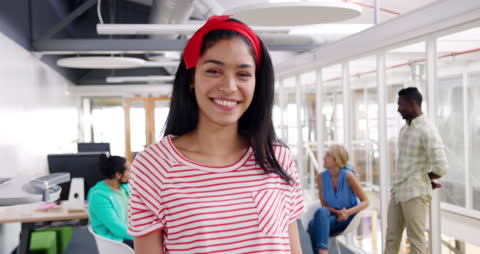 Confident Young Creative in Open Office Environment