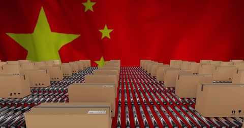 Cardboard Boxes Navigating Conveyor Against Chinese Flag Background