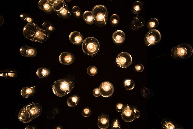 Array of Hanging Candle Jar Lights in Dark Room - Download Free Stock Photos Pikwizard.com