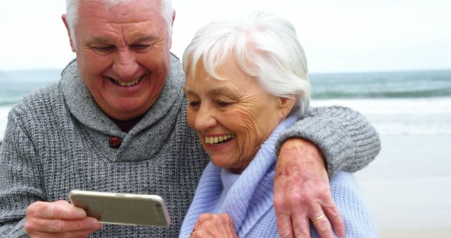 Happy Senior Couple Enjoying Time Together on Beach - Download Free Stock Images Pikwizard.com