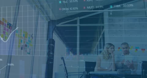 Colleagues Analyzing Stock Market Data in Office