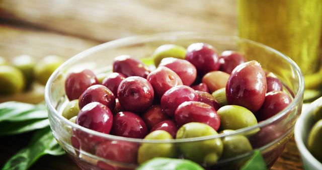 Close-Up of Fresh Green and Red Olives in Glass Bowl - Download Free Stock Images Pikwizard.com