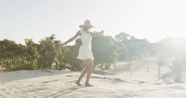 Woman Enjoying Summer Day on Sandy Beach in White Dress - Download Free Stock Images Pikwizard.com