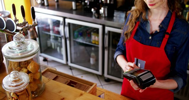 Barista Processing Payment at Coffee Shop Counter - Download Free Stock Images Pikwizard.com