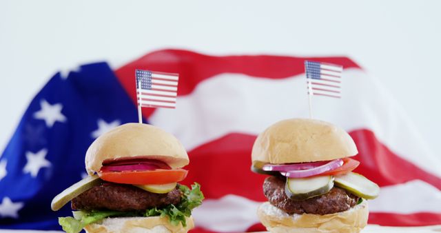Juicy burgers with American flags in patriotic setting - Download Free Stock Images Pikwizard.com