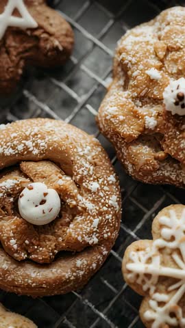 Vertical panning across cinnamon and gingerbread cookies on rack for festive baking