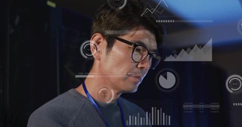 Korean businessman analyzing digital charts on stage during tech conference presentation