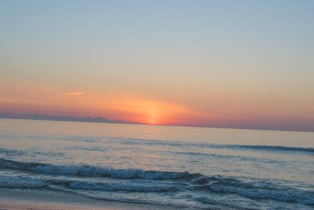 Tranquil Sunset Over Ocean Waves with Colorful Sky - Download Free Stock Photos Pikwizard.com
