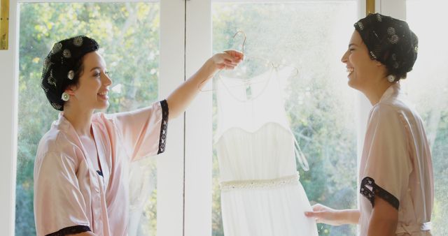 Happy Bridesmaids Preparing Wedding Dress Together - Download Free Stock Images Pikwizard.com