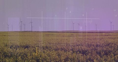 Finance Graphics Overlaying Wind Farm on Sunny Day