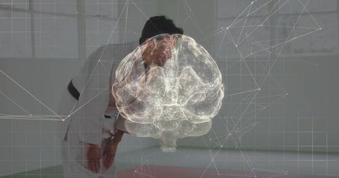 Bowing martial artist practicing in dojo with glowing brain hologram overlay, mind training