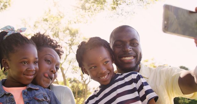 Happy Family Taking Selfie Outdoors on Sunny Day - Download Free Stock Images Pikwizard.com