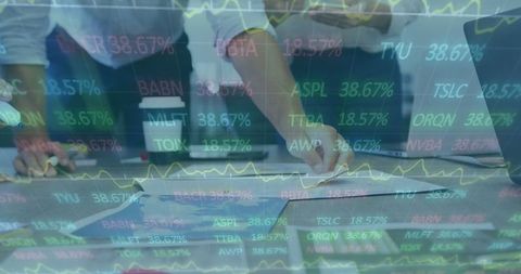 Colleagues Analyzing Data Projection in Office Meeting