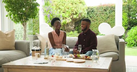 Joyful Couple Having Relaxed Lunch at Home