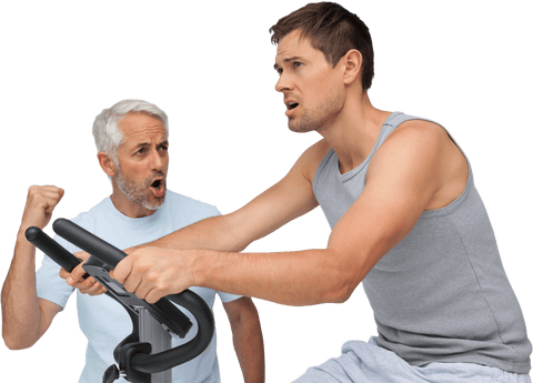 determined man training on exercise bike with enthusiastic coach - Download Free Stock Videos Pikwizard.com
