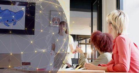 Presenting woman gesturing to team with digital network globe overlay in office meeting