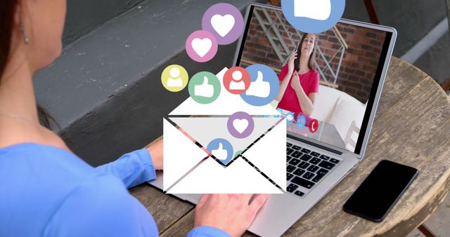 Image of email and social media icons over caucasian woman on laptop image call. Global social media, business, technology, data processing and digital interface concept digitally generated image.