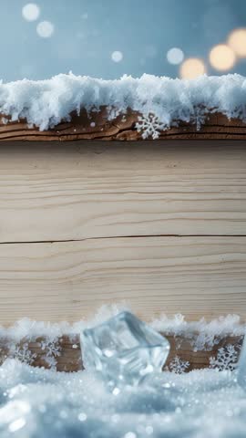 Vertical winter close-up revealing ice cube on snowy wooden plank with soft bokeh lights