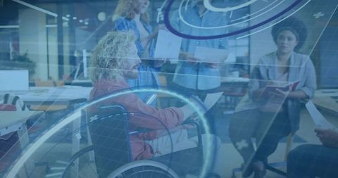 Inclusive team leader in wheelchair guiding collaborative ar brainstorming in open office