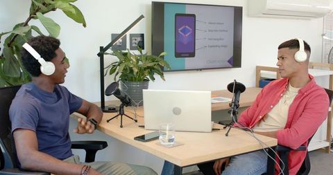 Two Male Podcasters Recording in Modern Studio Environment