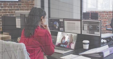 Businesswoman Engaged in Virtual Meeting with Digital Data Overlay