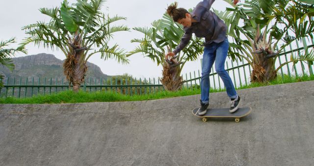 Young Man Skateboarding at Outdoor Skatepark - Download Free Stock Images Pikwizard.com