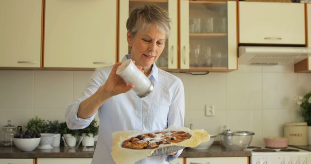 Senior Woman Preparing Homemade Pastry in Modern Kitchen - Download Free Stock Images Pikwizard.com