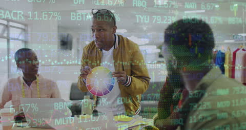 Diverse Coworkers Analyzing Market Data in Modern Office