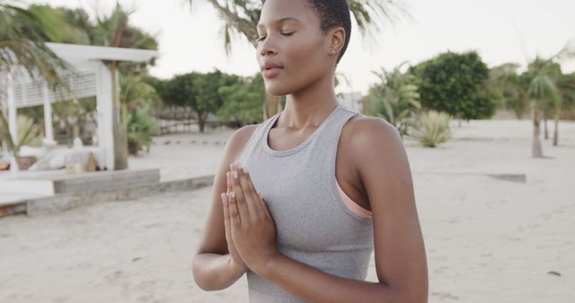 Serene Woman Meditating on Beach in Tropical Setting - Download Free Stock Images Pikwizard.com