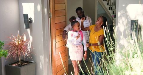 Joyful African American Family Sending Daughter to School