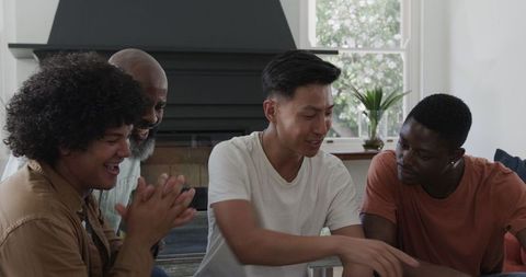 Diverse group of friends enthusiastically engaging in planning session