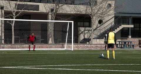 Young Soccer Player Preparing to Shoot Goal on Bright Day