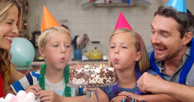 Happy family celebrating birthday together - Download Free Stock Photos Pikwizard.com