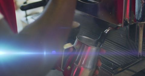 Barista Steaming Milk With Espresso Machine