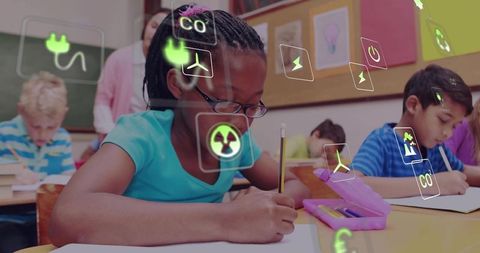 Elementary student writing in classroom wearing glasses with augmented energy icons