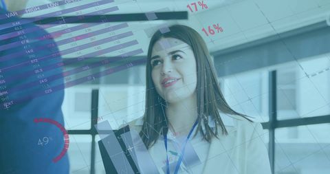 Businesswoman Analyzing Data on Tablet with Financial Charts Overlay