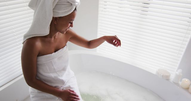 Relaxed Woman Preparing Bath with Towel Wrapped - Download Free Stock Images Pikwizard.com