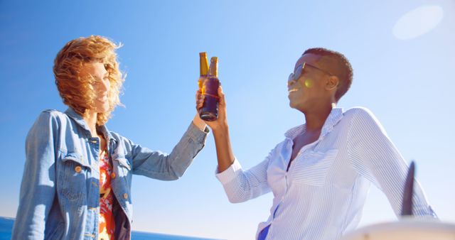 Two Friends Enjoying Beers Outdoors on Sunny Day - Download Free Stock Images Pikwizard.com