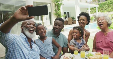 Happy Multigenerational Family Enjoying Breakfast and Taking Selfie in Garden - Download Free Stock Images Pikwizard.com