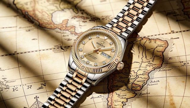 Two-tone gold luxury wristwatch with jubilee bracelet and day-date display on vintage map
