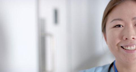 Smiling young asian nurse in hospital environment
