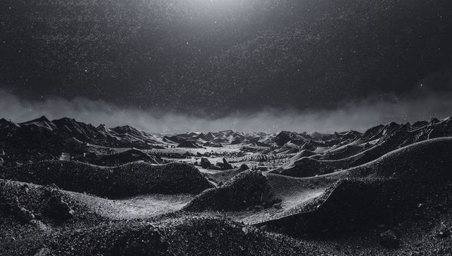 Celestial Night Sky Over Rugged Desert Landscape