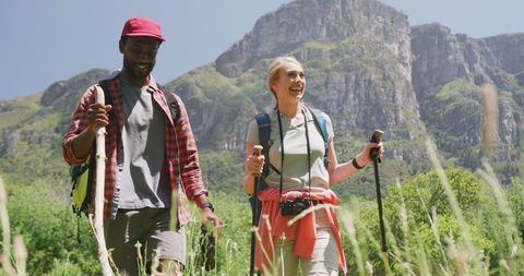 Happy Diverse Couple Hiking in Scenic Mountains - Download Free Stock Images Pikwizard.com