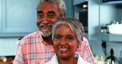 Happy Senior Couple Smiling in Home Kitchen
