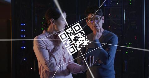 diverse technicians analyzing digital data with qr code interface - Download Free Stock Images Pikwizard.com