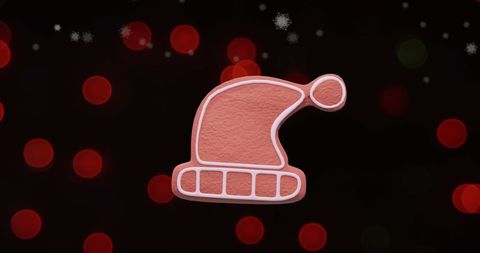 Festive Gingerbread Santa Hat Against Christmas Lights