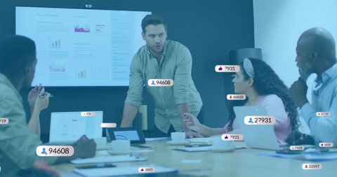 Diverse Team Meeting with Social Media Analytics in Modern Office